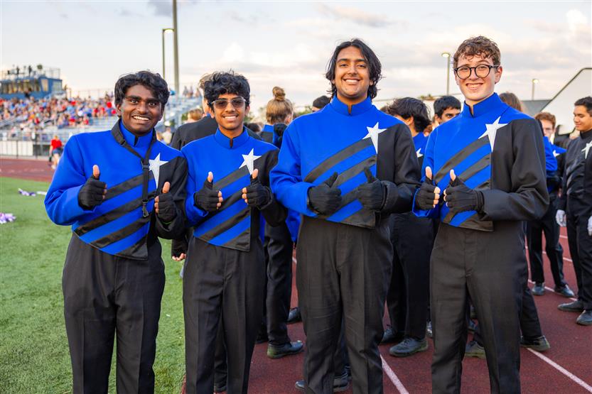 Students perform on football field